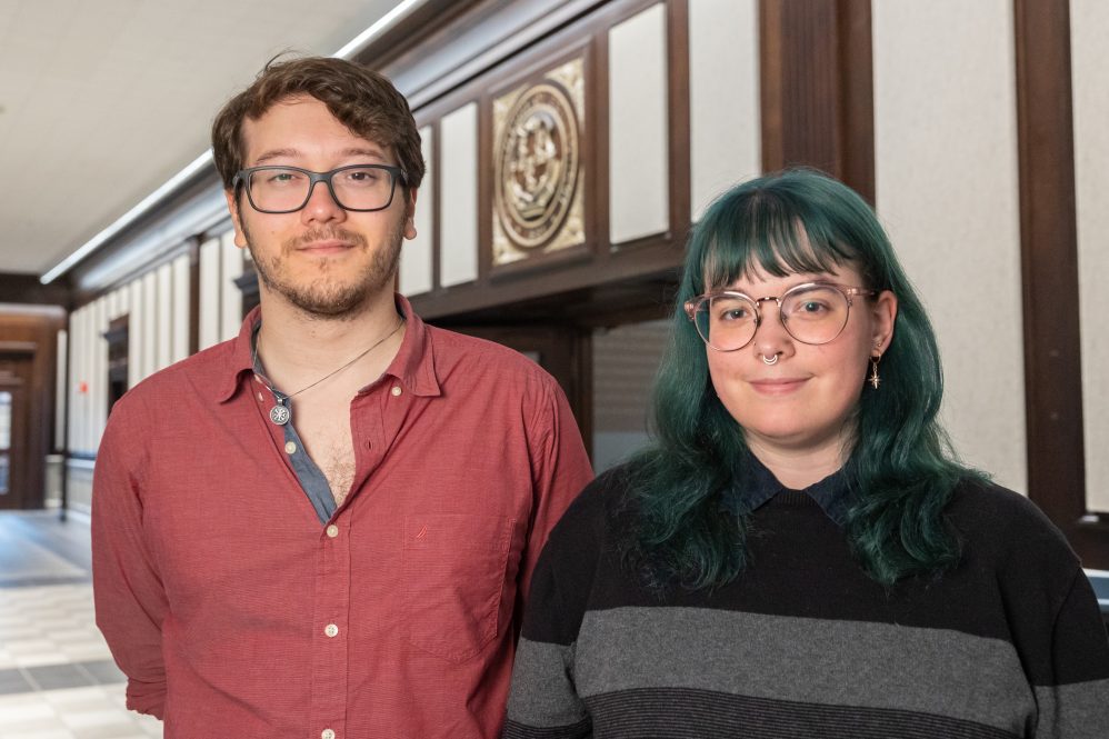 Nicholas Gonzales and Maggie Ward, both 2023 winners of the National Science Foundation Graduate Research Fellowship, pose for a photo in Wilbur Cross Building
