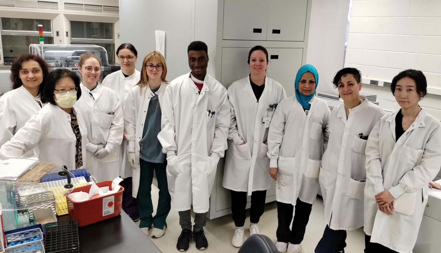 group portrait of lab employees in lab coats