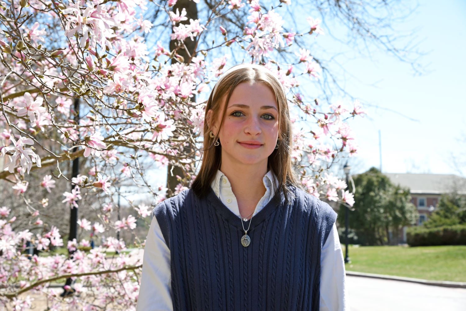 Emma Forster ‘23 (CAHNR), a major in animal science in the Department of Animal Science, poses for a portrait for Commencement 2023 outside Charles Lewis Beach Hall (BCH). Apr. 10, 2023. (Jason Sheldon/UConn Photo)