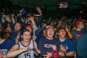 Fans celebrate at Gampel Pavilion after the UConn Men's Basketball team beats San Diego State University in Houston for the NCAA Men's championship title on April 3, 2023
