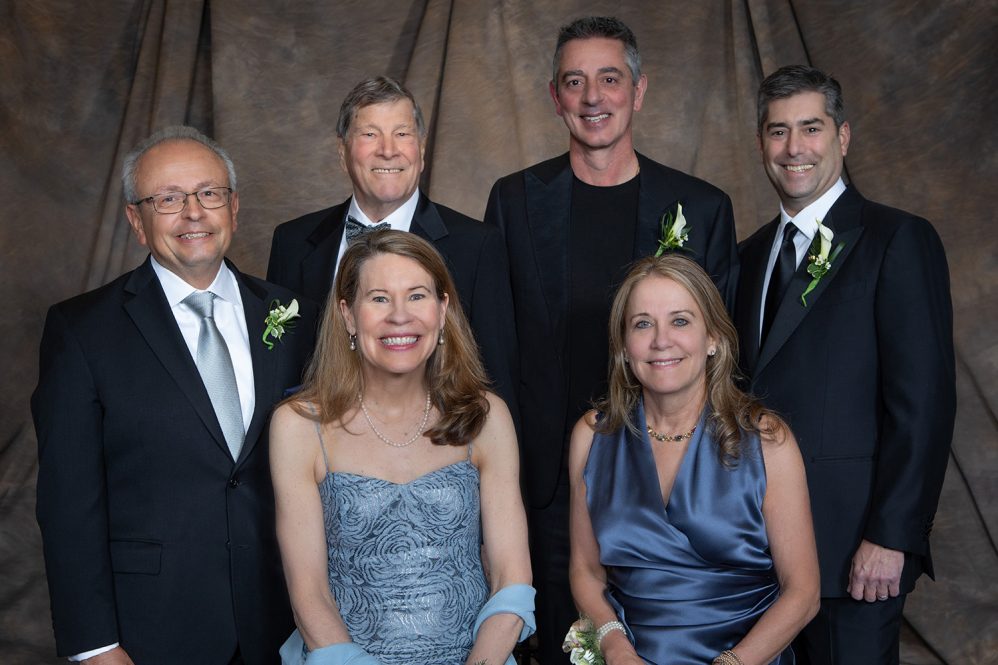 UConn School of Business honorrees pose for a photograph in a formal setting. Front (l to r): Maria Fahy-Barry and Debra Hess Back: Thomas Marshella, Dean John A. Elliott, Anthony Rizza and Richard Vogel.