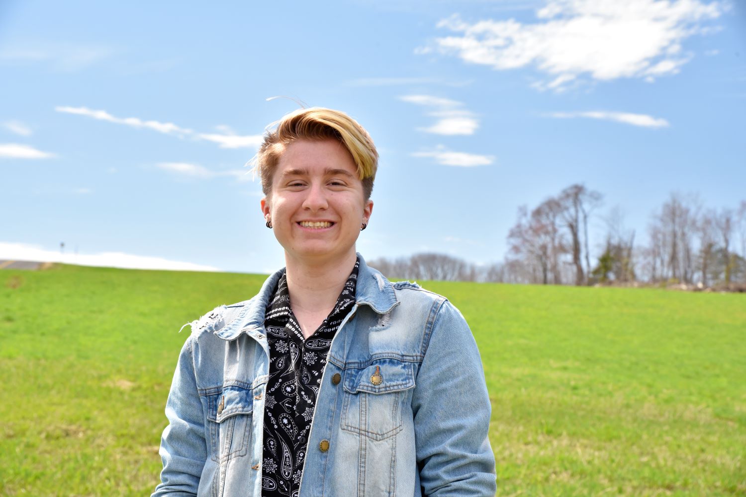 Cameron Deslaurier ‘23 (CAHNR), a major in natural resources in the Department of Natural Resources and the Environment in the College of Agriculture, Health and Natural Resources, poses for a portrait for Commencement 2023 on Horsebarn Hill (HBH). Apr. 12, 2023. (Jason Sheldon/UConn Photo)