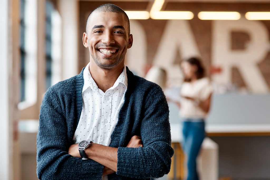 Portrait of a confident young businessman working in a modern office