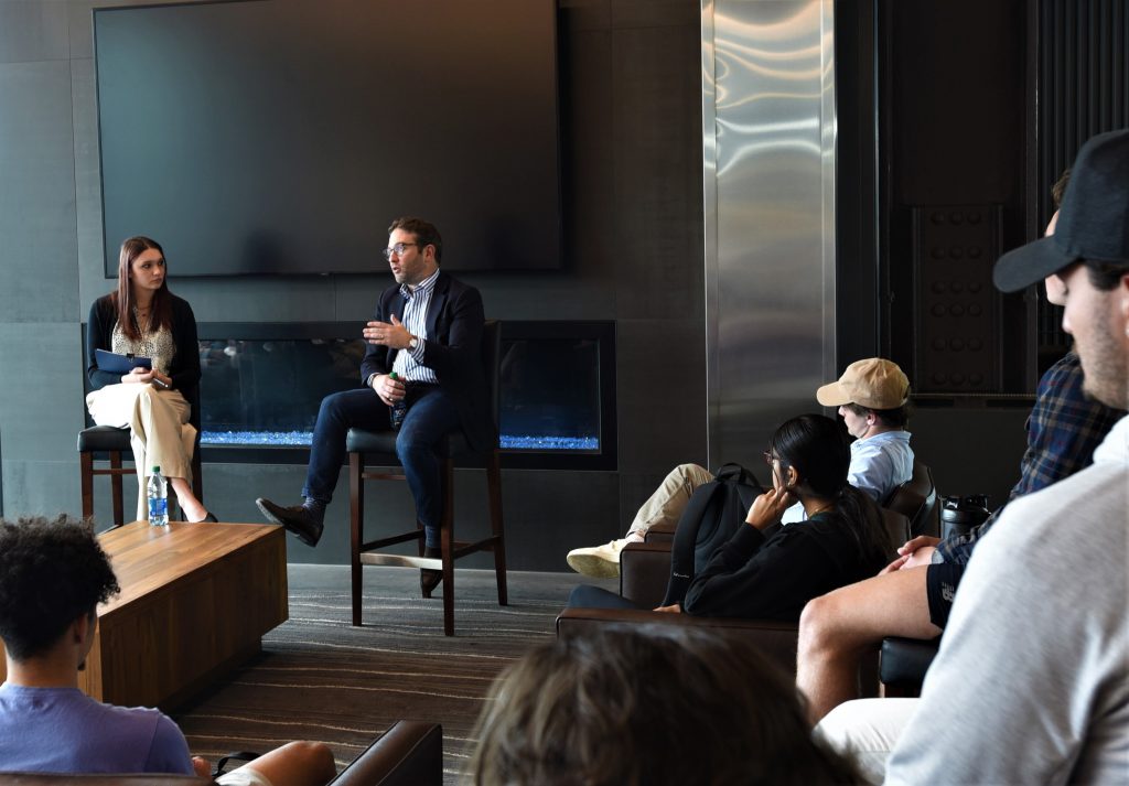 Jake Sherman, the journalist, author, and co-founder of Punchbowl News, speaks with UConn journalism and entrepreneurship students about the future of the press in a moderated discussion held at the Toscano Family Forum on April 11, 2023.