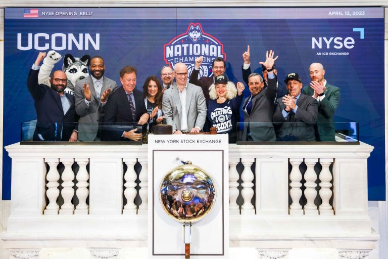 After winning the NCAA Championship,  UConn Men's Basketball Coach, Dan Hurley, CT Governor Ned Lamont, and UConn President Radenka Maric, ring the opening bell at the New York Stock Exchange.