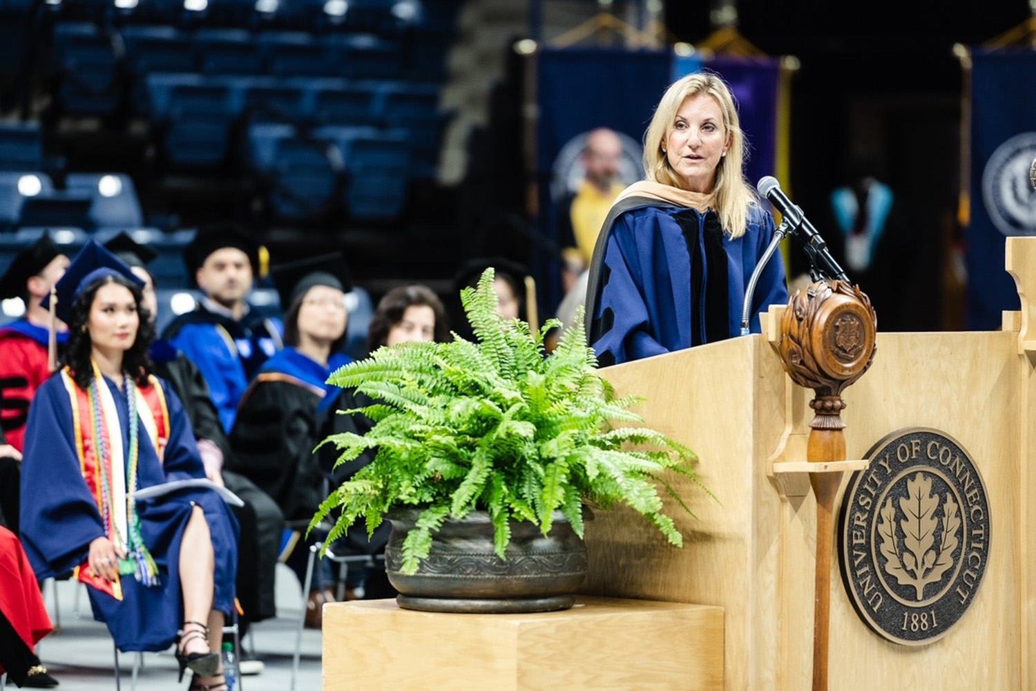 Melinda Brown '77, '85 MBA delivering the commencement address during the School of Business commencement ceremony on May 6. (Nathan Oldham / UConn School of Business)