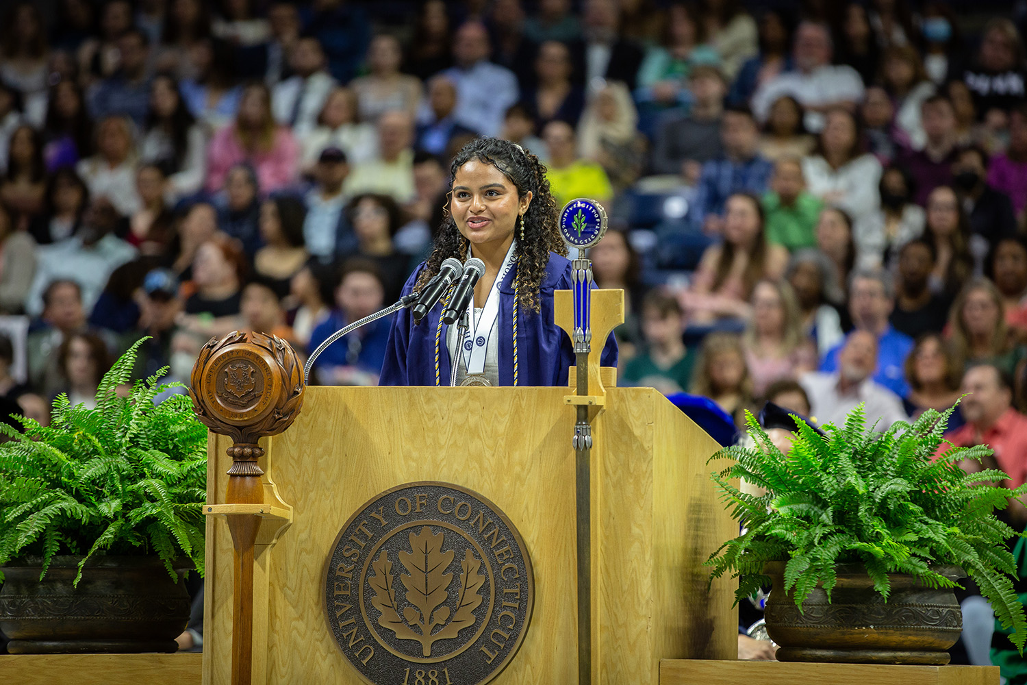 Nidhi Nair ’23 stands behind podium during commencement.