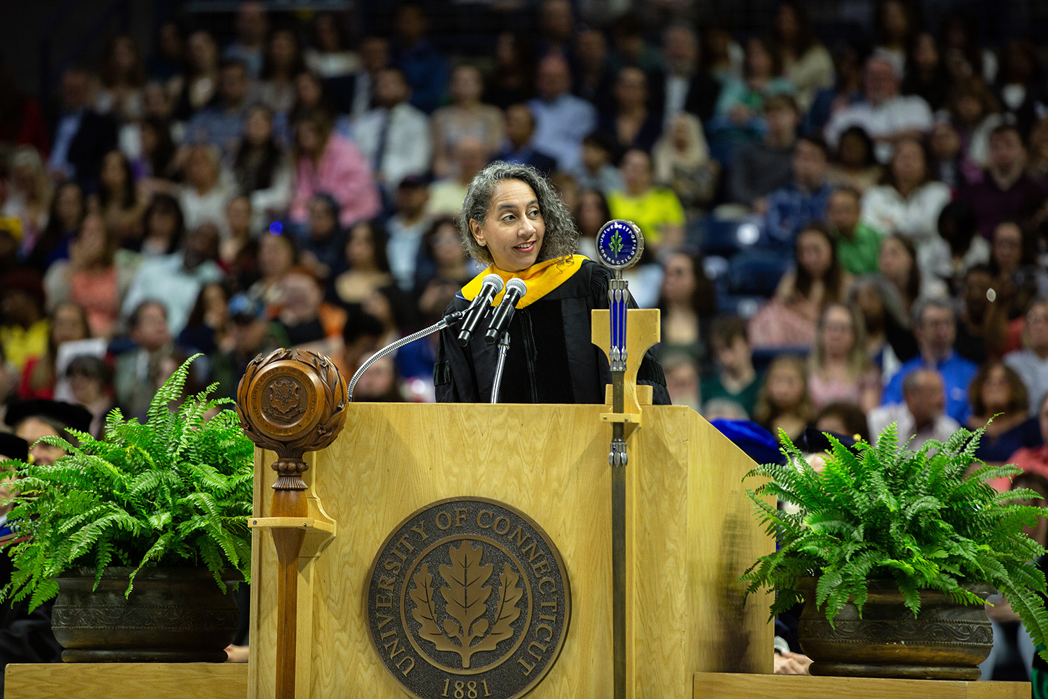 Talitha Washington stands behind the podium during commencement.