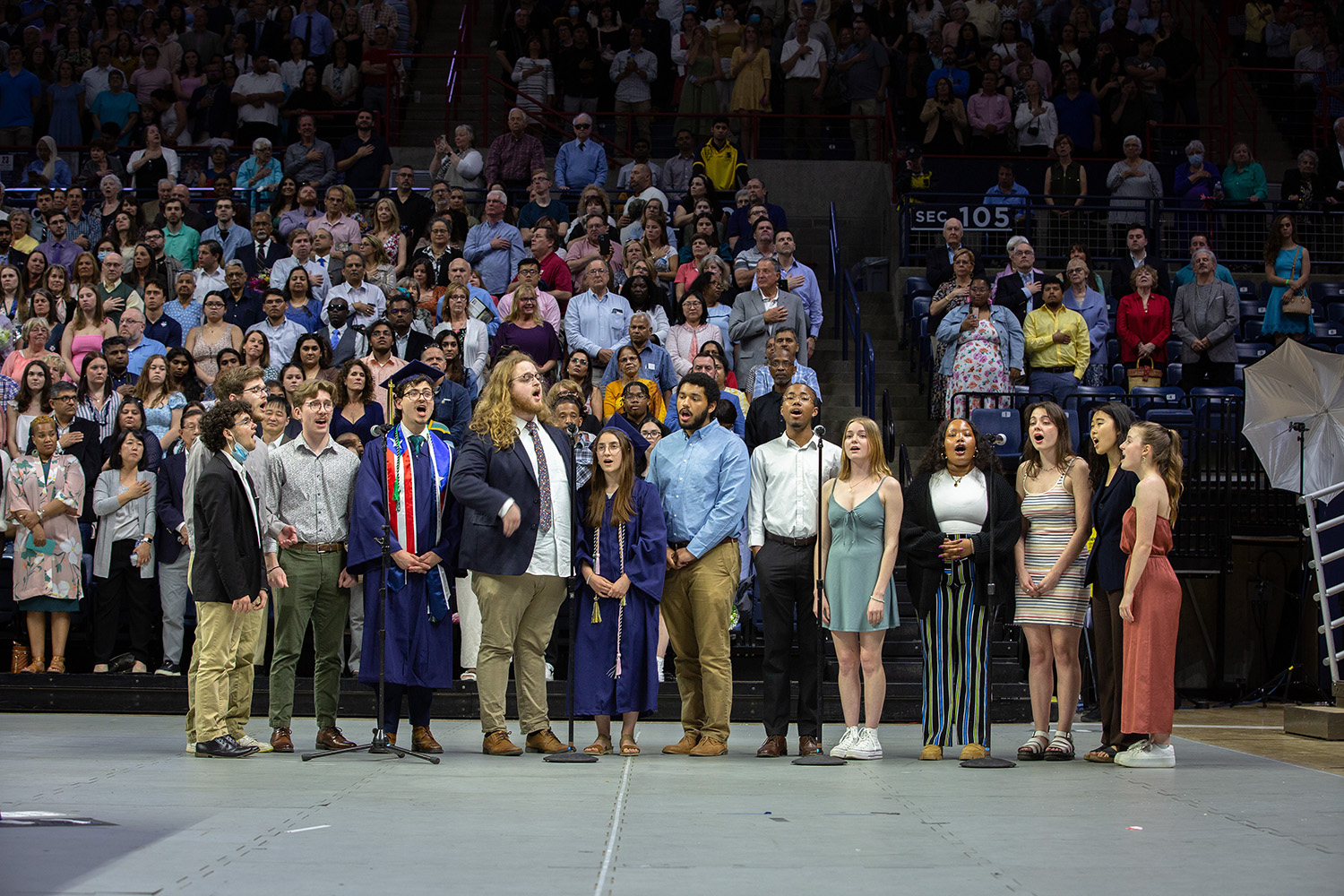 Extreme Measures a cappella group sings the national anthem during commencement.