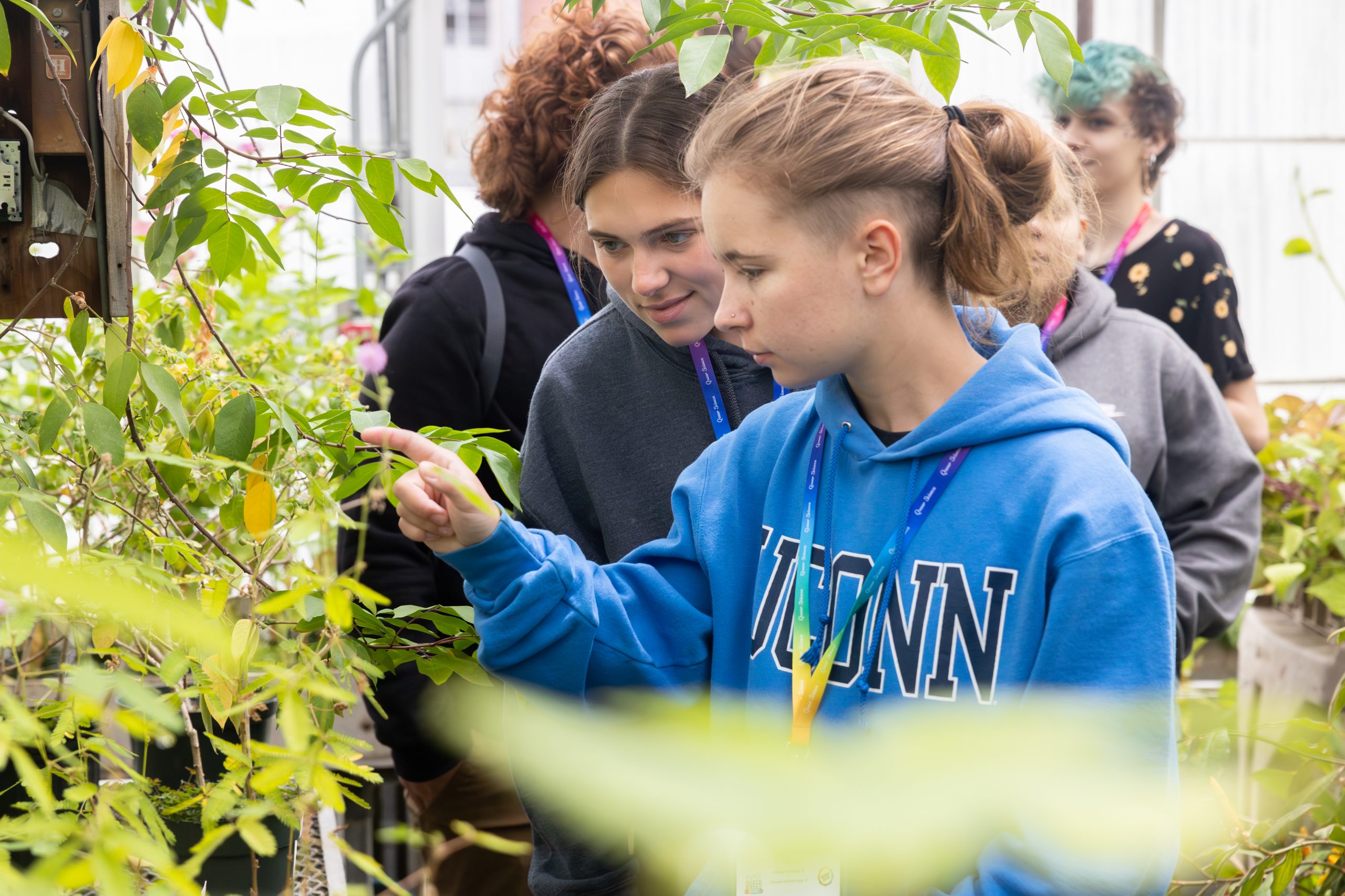Hayes also led students through the EEB Biodiversity Education and Research greenhouses and pointed out various species of plants, including a sensitive plant that Brynn Mesick of Manchester High School, front, and Ava Harriman of Haddam-Killingworth High School took notice of