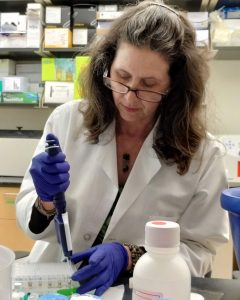 Sara Olson at work in her lab