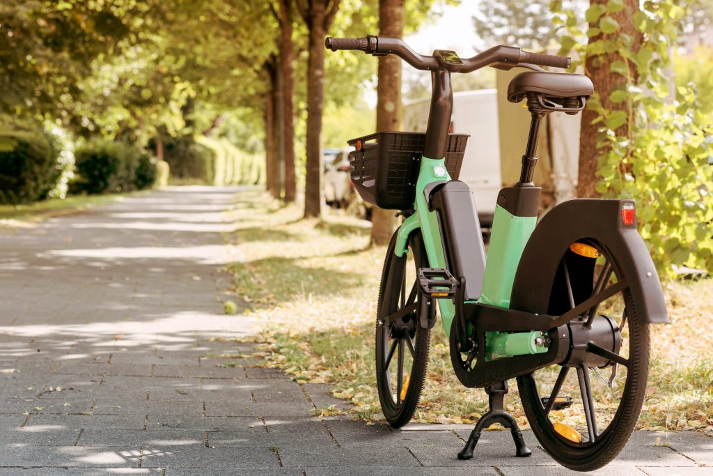 An e-bike stands on a suburban street.