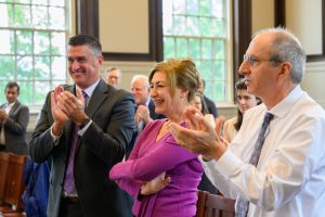 Susan Herbst receives applause as it is announced that the former Oak Hall will be renamed Susan Herbst Hall during a Board of Trustees meeting at the Wilbur Cross Building
