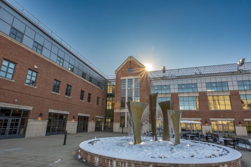 Sunlight glints off a snow-covered fountain