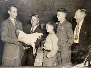 UConn Extension agent and poultry sciences Prof. William Aho, left, talks with 4-H Club students visiting UConn in the mid-1950s.
