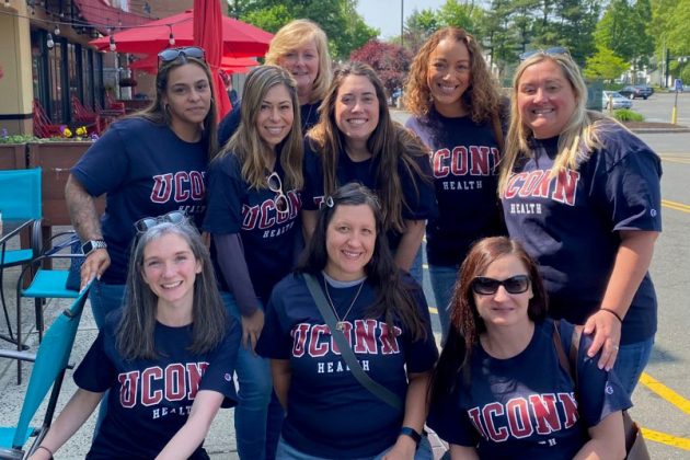 group portrait outdoors of women wearing UConn Health shirts
