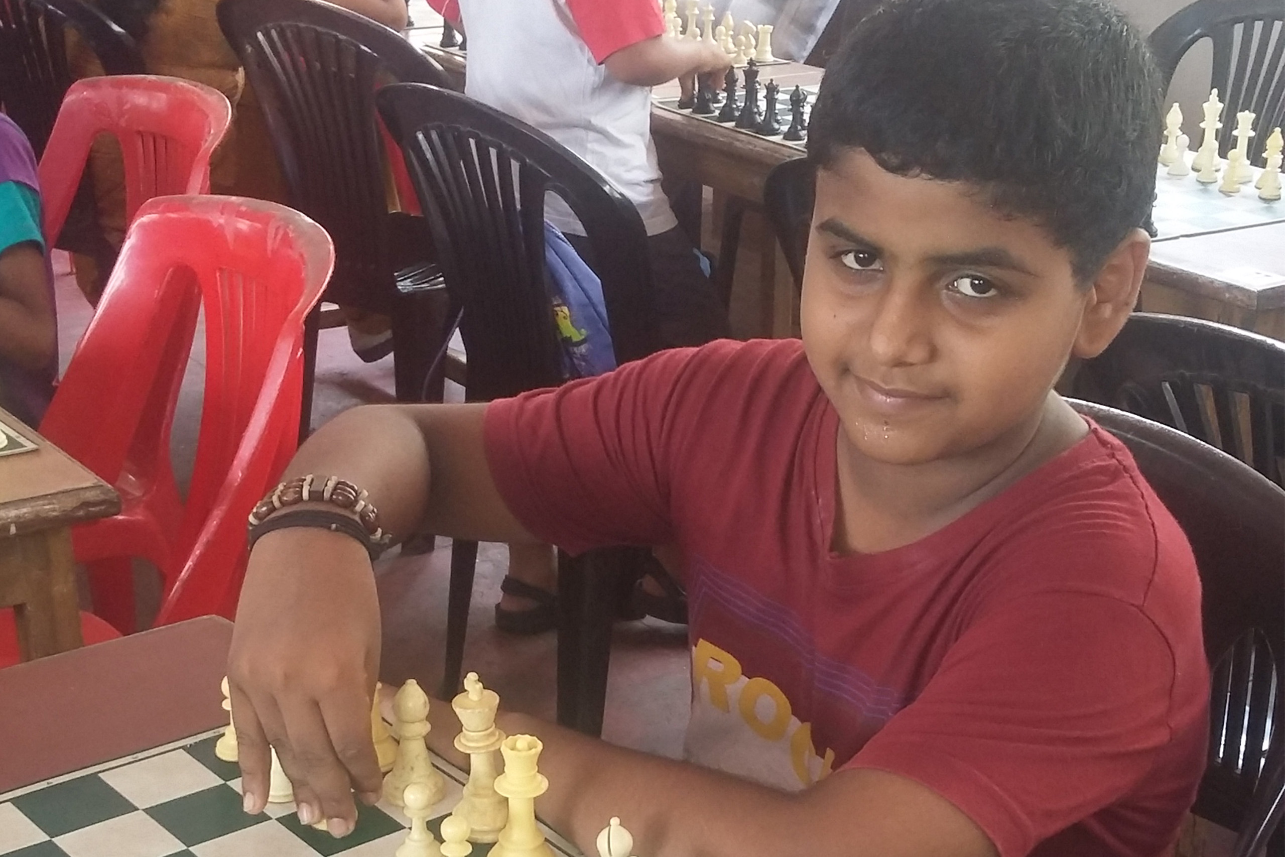 Jithu playing chess as a child
