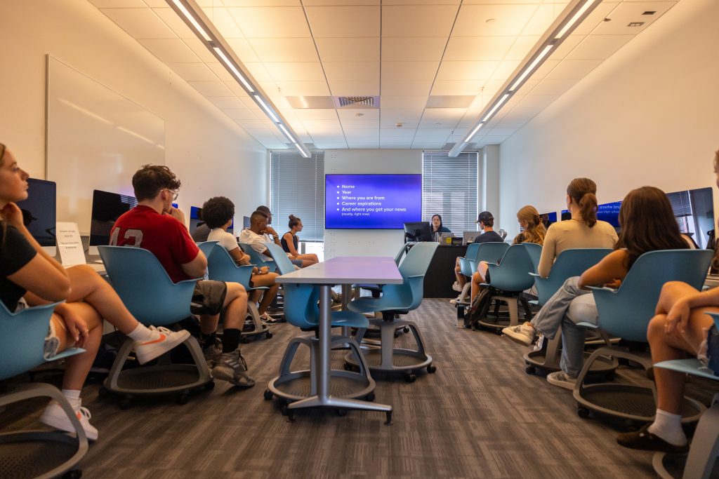 UConn journalism professor Marie Shanahan leads her "Portfolio I: Multimedia Skills" class in Oak 472 on the first day of classes for the Fall 2023 semester