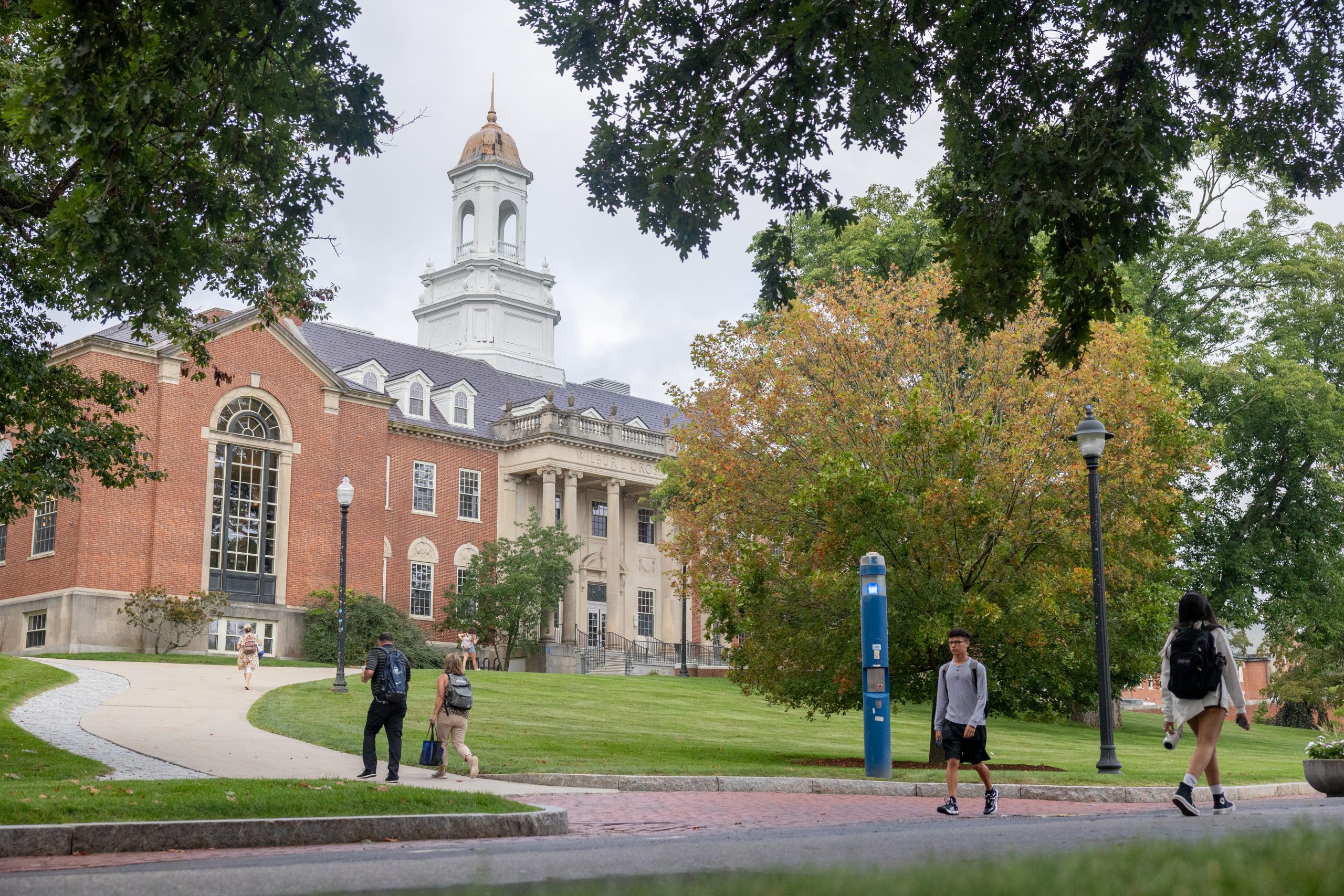 UConn students walk across campus on the first day of classes for the Fall 2023 semester