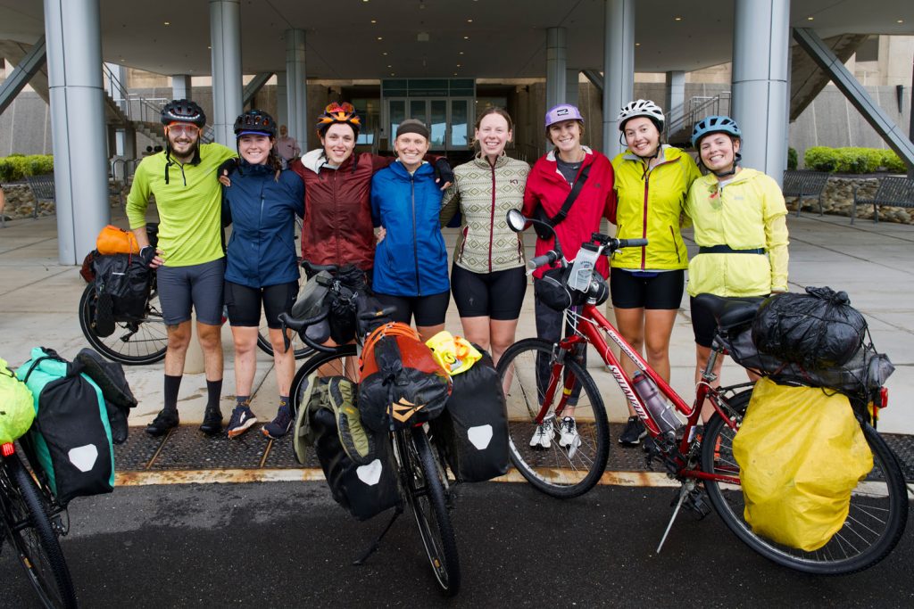 Eight students in cycling gear