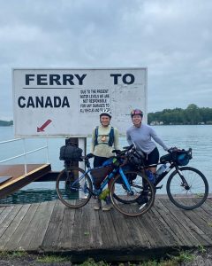Two cyclists on a ferry dock