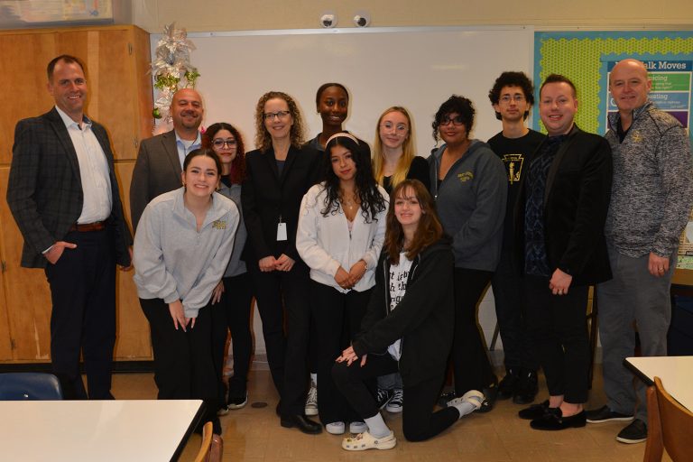 A group of high school students gather with Neag School and East Hartford Public Schools' educators and administrators.