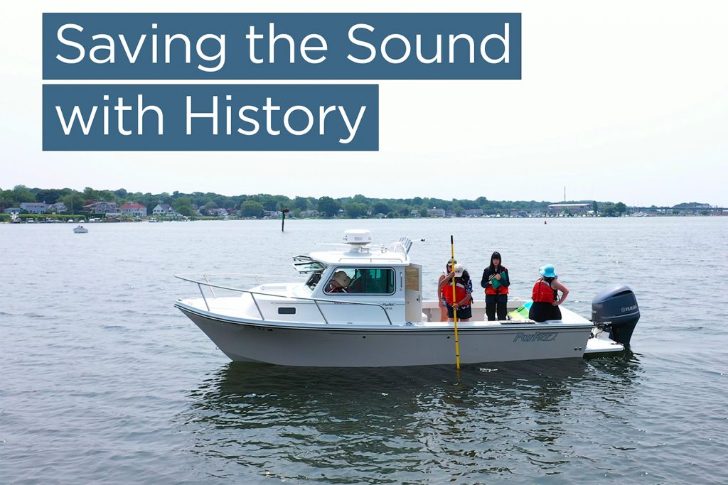 A boat carrying researchers on the Long Island Sound with the video title "Saving the Sound with History" overlayed
