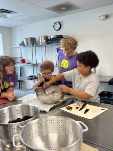 Program participants worked with UConn Sustainable Community Food System fellows each day to prepare their meals in a teaching kitchen at Auerfarm.