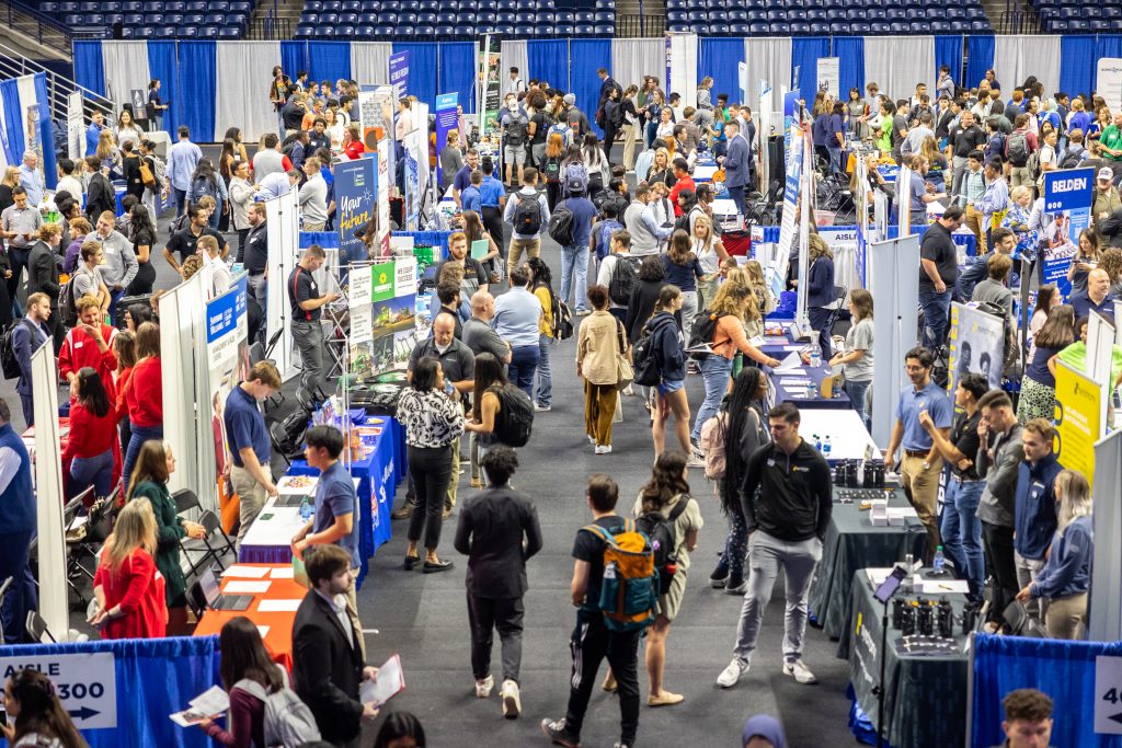 UConn students meet with potential employers at the all-university career fair in Gampel Pavilion on Sept. 19, 2023.