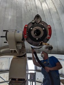 Less than two weeks after touring the inside of the observatory in January of 2023, the team, including Allen Hall pictured here, began taking apart the old telescope and started working on restoring the facility.