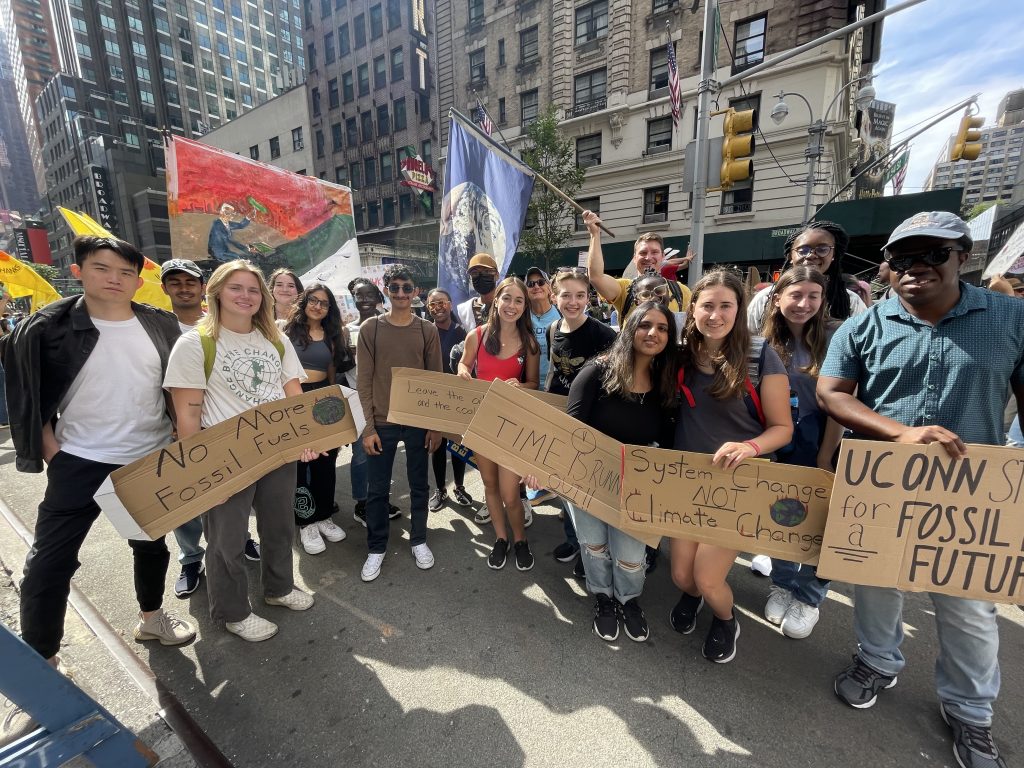 Students holding climate protest signs in a march.