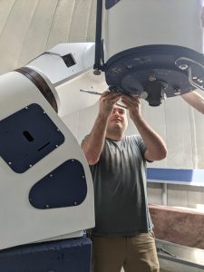 Here Guthrie is working on reassembling the telescope. He says, “My graduate and postdoc work was mostly theory-based, so being back in a place where I can literally get my hands dirty again makes me happy, and seeing the results of our labor has been rewarding.”