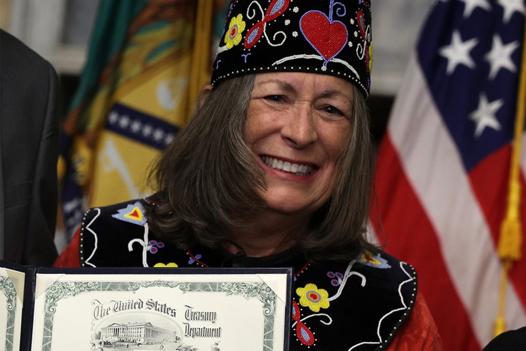 U.S. Treasurer and Mohegan Tribe Chief Lynn Malerba shows her signature for the purpose of United States currency during a ceremonial swearing-in for Malerba at the Cash Room of the Treasury Department