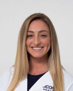 Carly Roy portrait in white coat