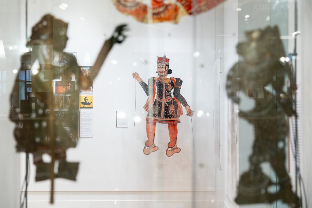 Items on display in the "Tradition and Revolution in Indian Shadow Puppetry" exhibition currently on display in the Ballard Institute and Museum sit in the exhibit
