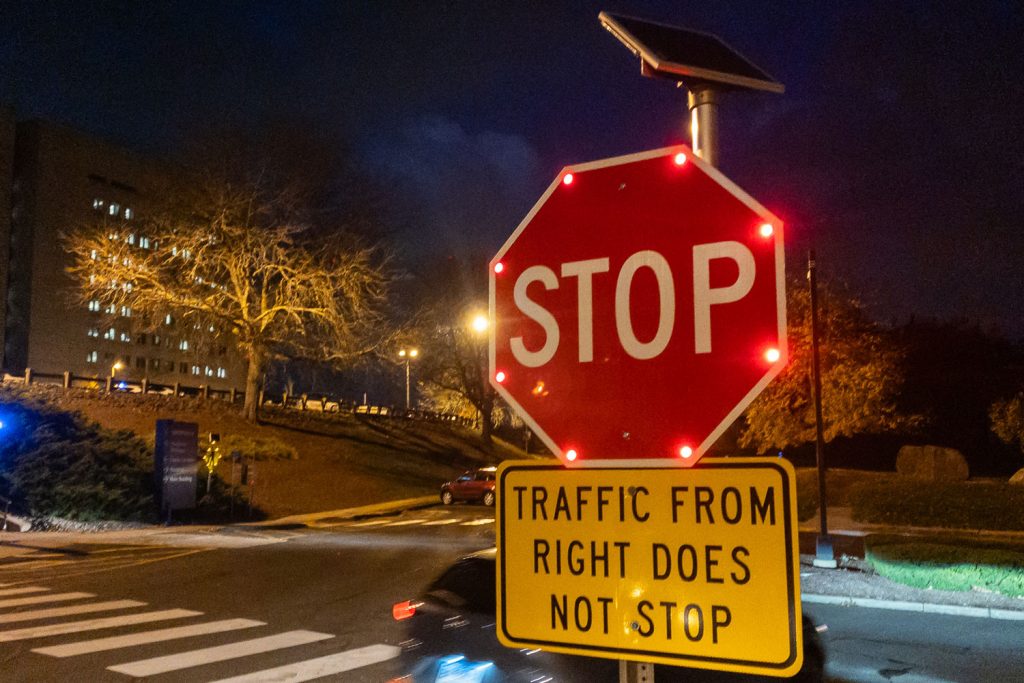 flashing stop sign at dusk