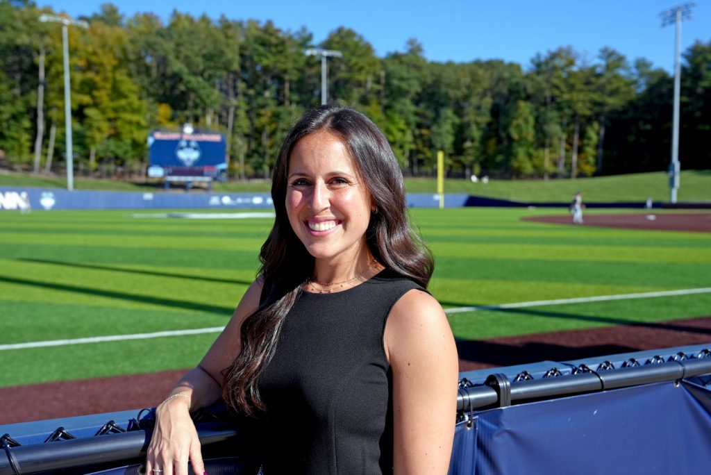 Smiling woman at baseball field