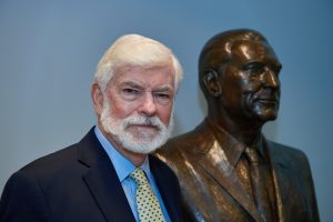 Former Senator Chris Dodd, with the bust of his father at the Thomas J. Dodd Research Center