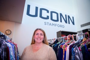 Laura Bunyan, associate professor of sociology in residence, at the Clothing for All closet at the Stamford campus