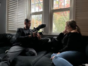 UConn associate professor and filmmaker Oscar Guerra films with Ruth, the main participant in his new documentary project focused on mental health in the Latino community. The project is supported by a year-long fellowship from UConn's Humanities Institute.