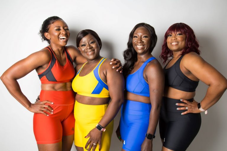 Group of black women in exercise clothes smiling