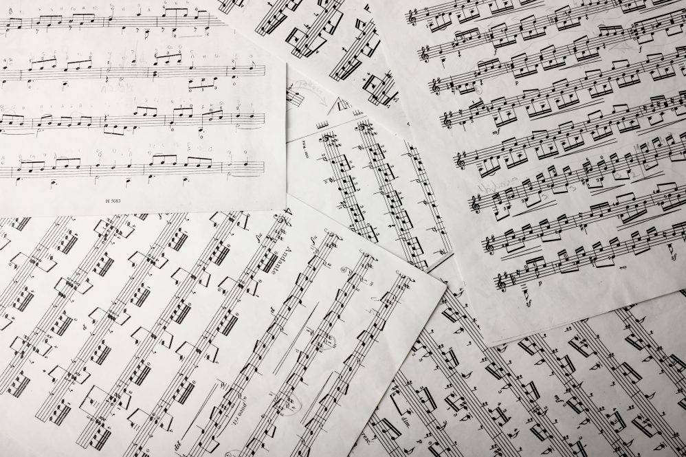 View of music notes on paper sheets.