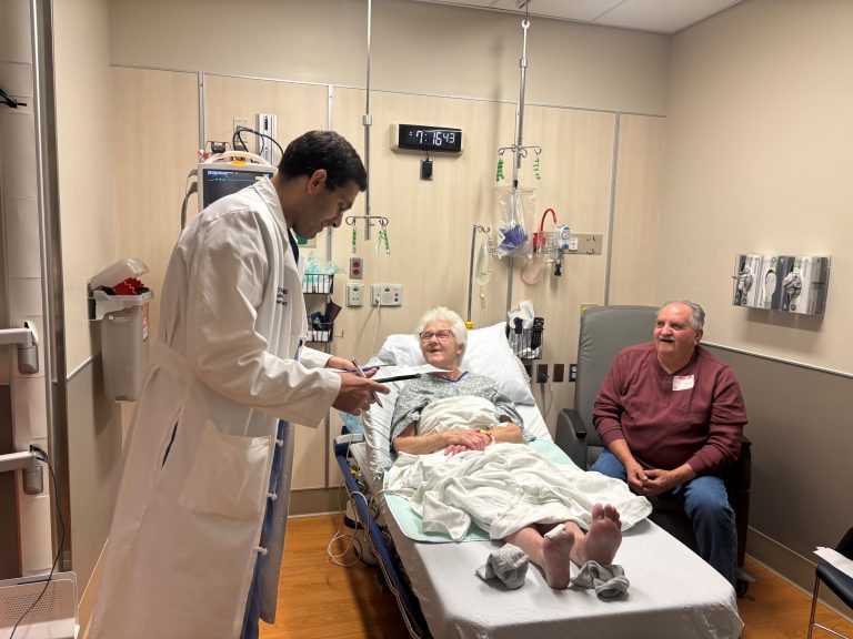Maureen Marchetti, and her husband Jim, on Jan. 25 with her UConn Health Vascular Surgeon Dr. Justin D’Addario celebrating her big day of being the first in New England to undergo the DETOUR procedure for severe PAD (UConn Health Photo/Carolyn Pennington).