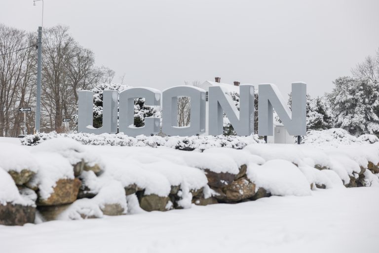 Snow falls across the UConn Storrs campus during the first snowstorm of the season