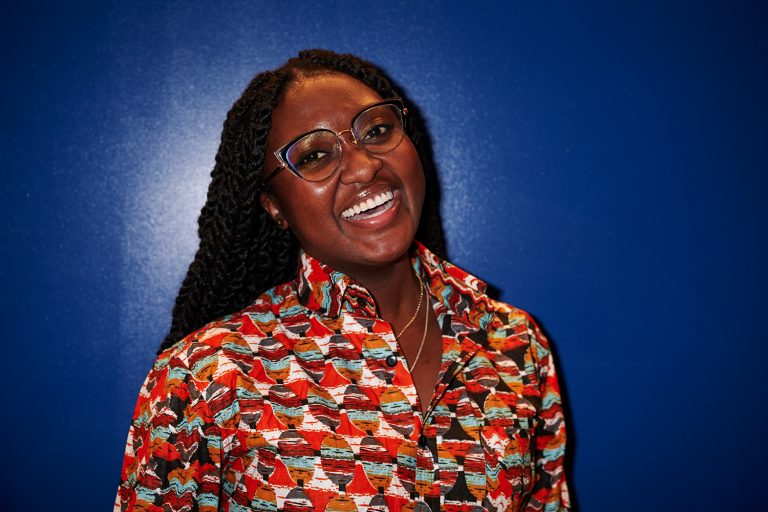 Celebrating her Ghanaian culture, Naadu Adjoka-Nartey wears a shirt of Ankara, or African wax print fabric, characterized by bold colors and designs.