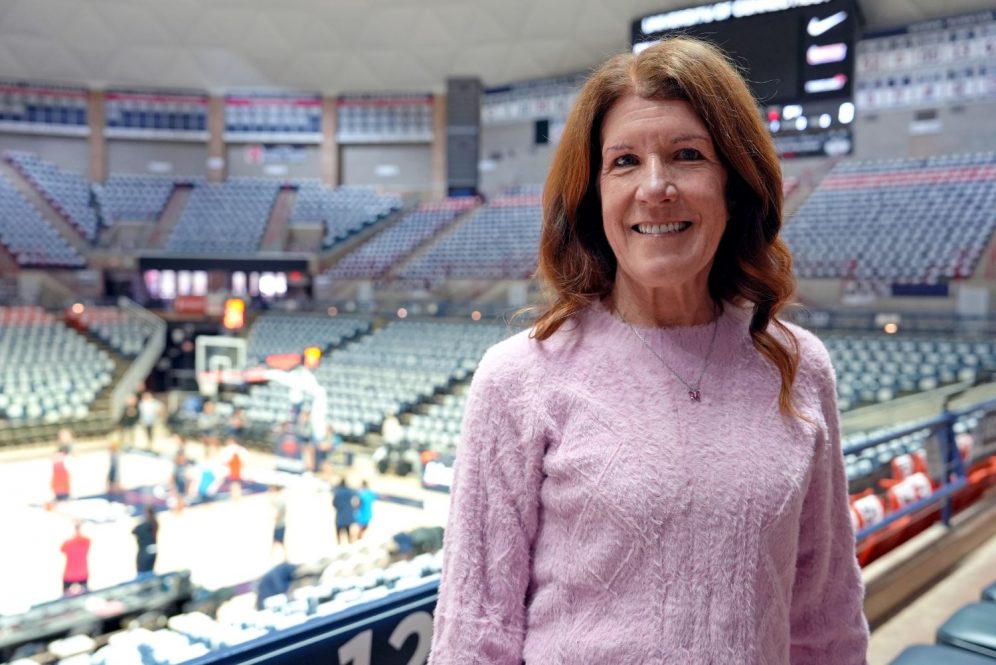 Woman standing near a basketball court