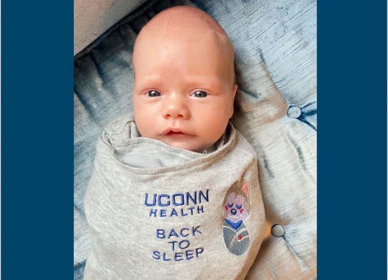 This little Husky is enjoying sleeping on his back in his new UConn Health gifted sleep sack. Francis Scott Moriarty was born at UConn John Dempsey Hospital on January 3, 2024. He was 6 lbs., 12 oz., and 19.5 inches long. (Photo by Mom).