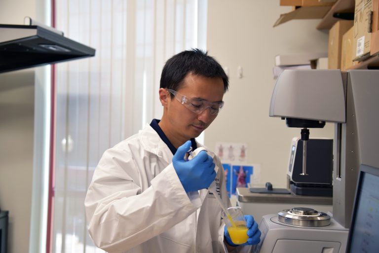 Yangchao Luo of the Department of Nutritional Sciences in the College of Agriculture, Health and Natural Resources works in a laboratory in the Advanced Technology Laboratory