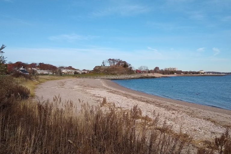 Landscape at Savin Rock, West Haven, CT, USA showing the outcropping and the neighboring beach
