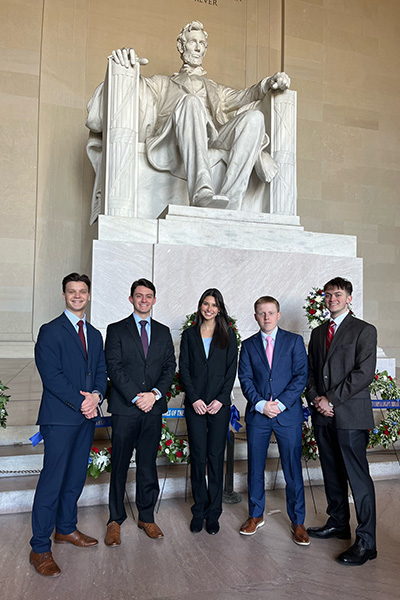 The team at the Lincoln Memorial during their trip to American University in Washington, D.C. Left to Right Tyler Martin, Shane Markle, Tara Sperry, Matthew Conroy, Adam Skarre.